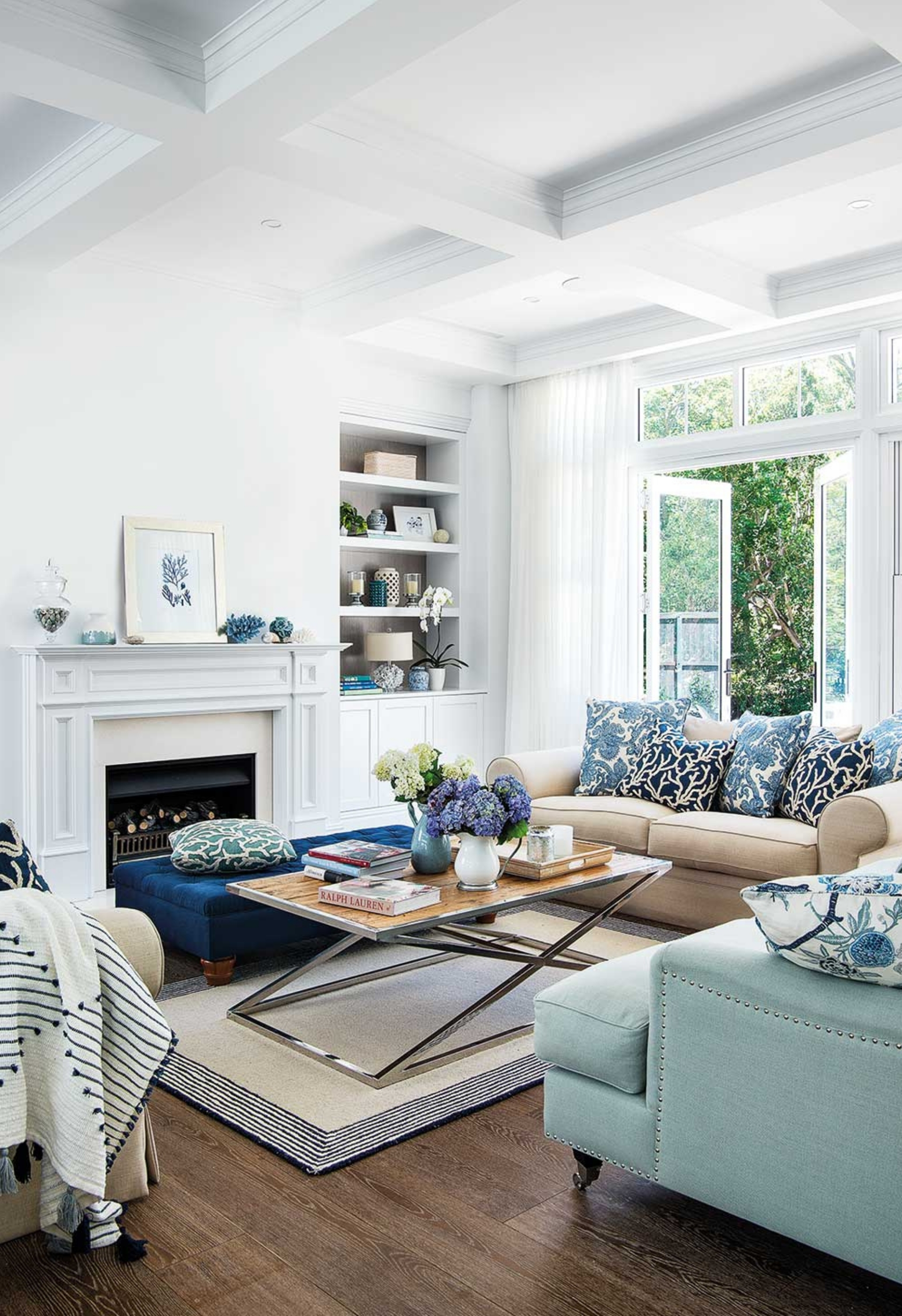 Hamptons style lounge room with blue and white decor.