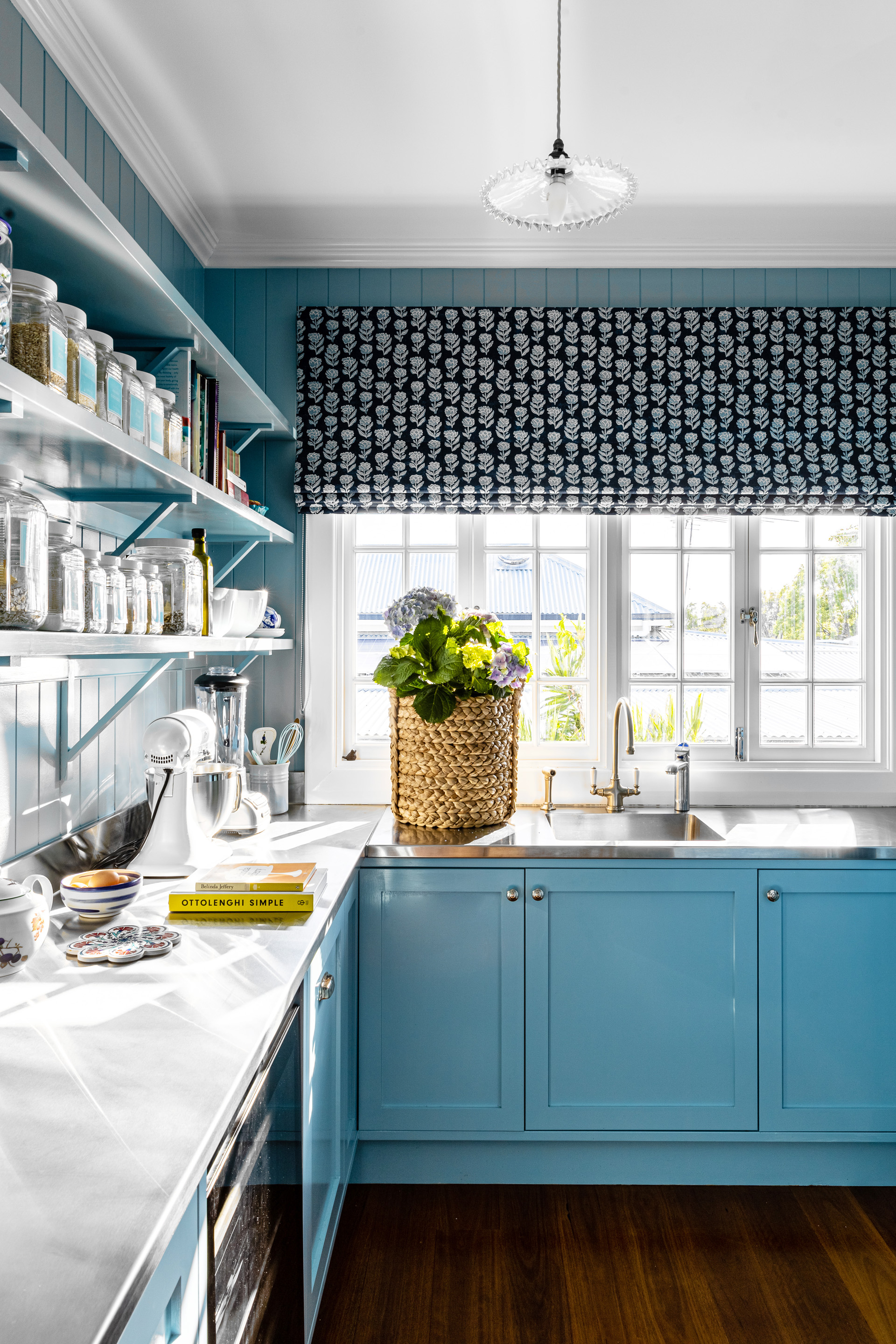 butler's pantry with stainless steel benchtops, open shelving and blue painted cabinetry
