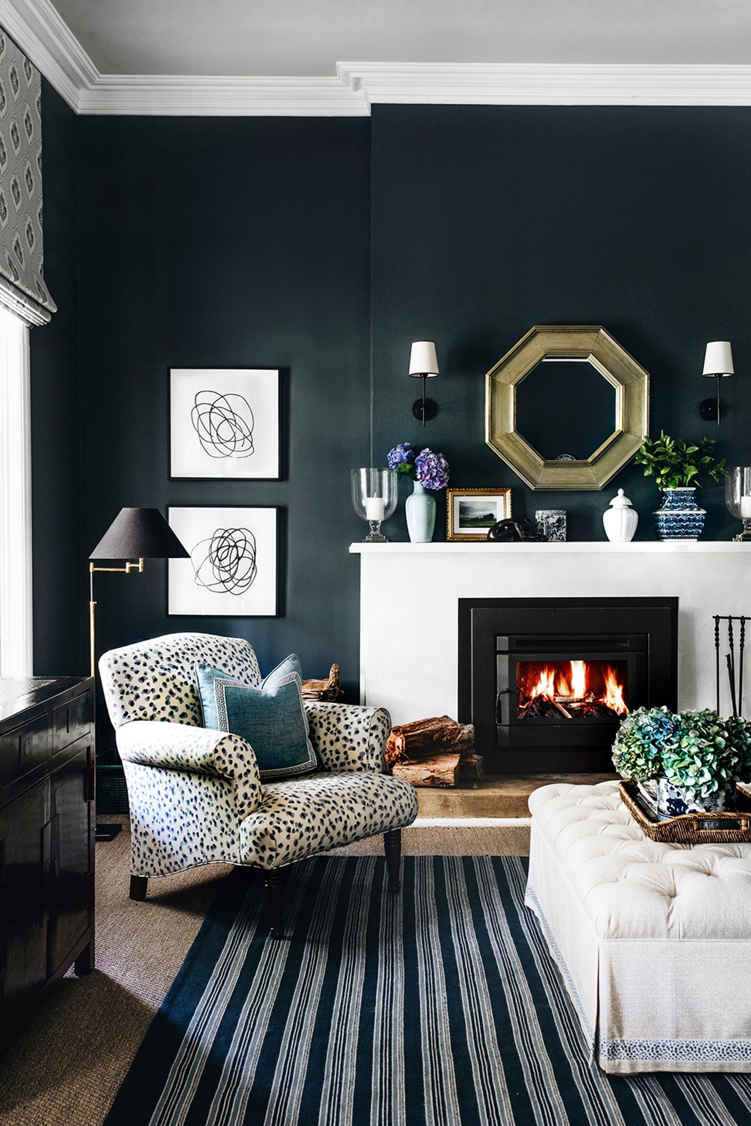 Dark and moody living room with open fireplace