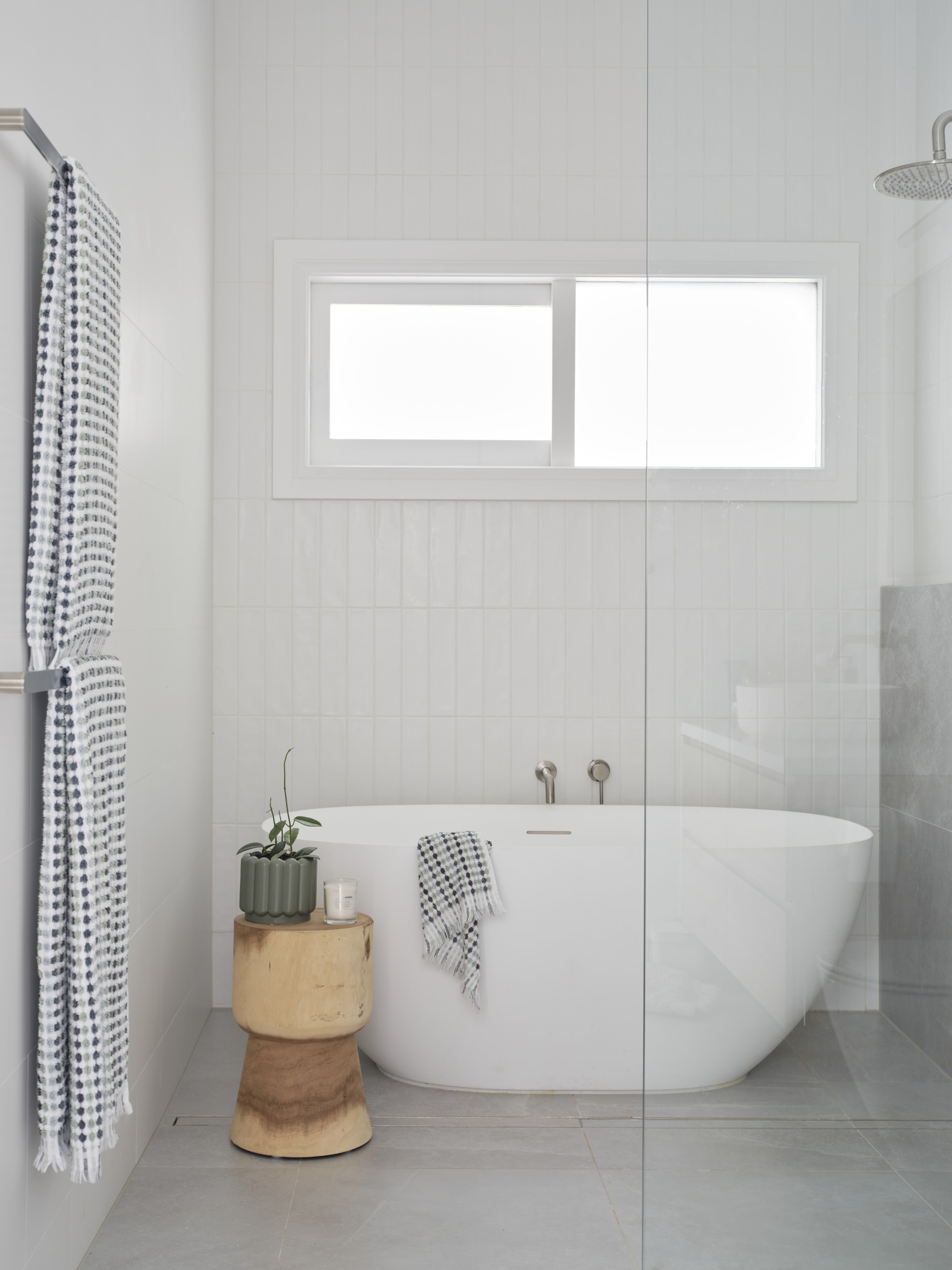 Renovated family bathroom and white subway tiles with bath.