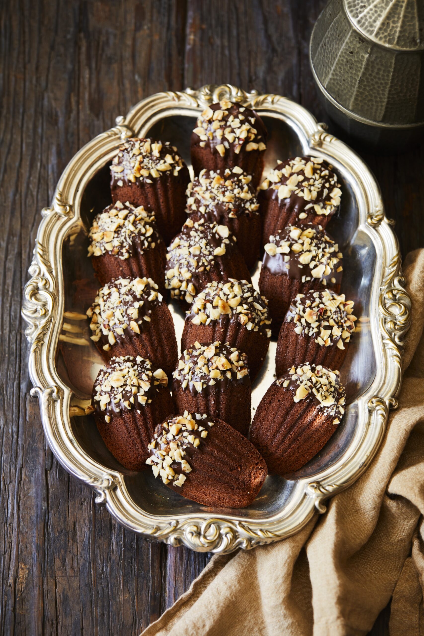Chocolate hazelnut madeleines on a tray.