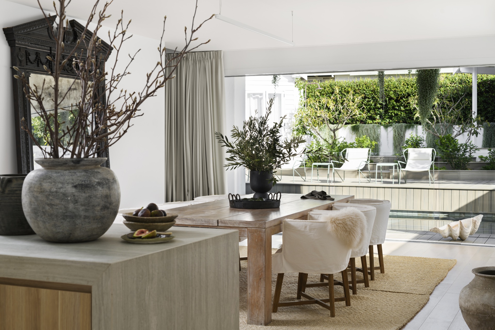 The open-plan dining area overlooking the pool and garden.