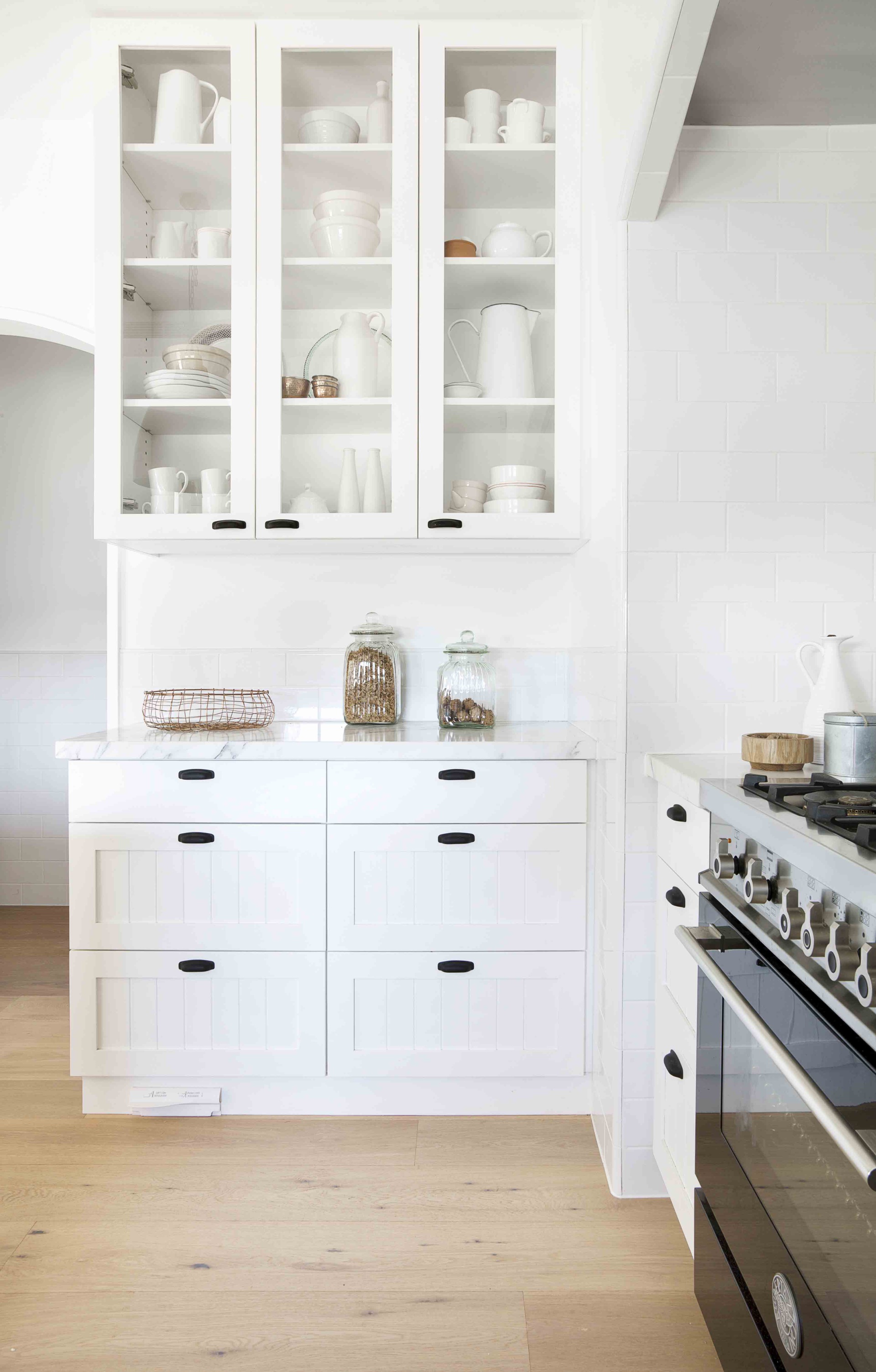 White contemporary kitchen storage cabinets.