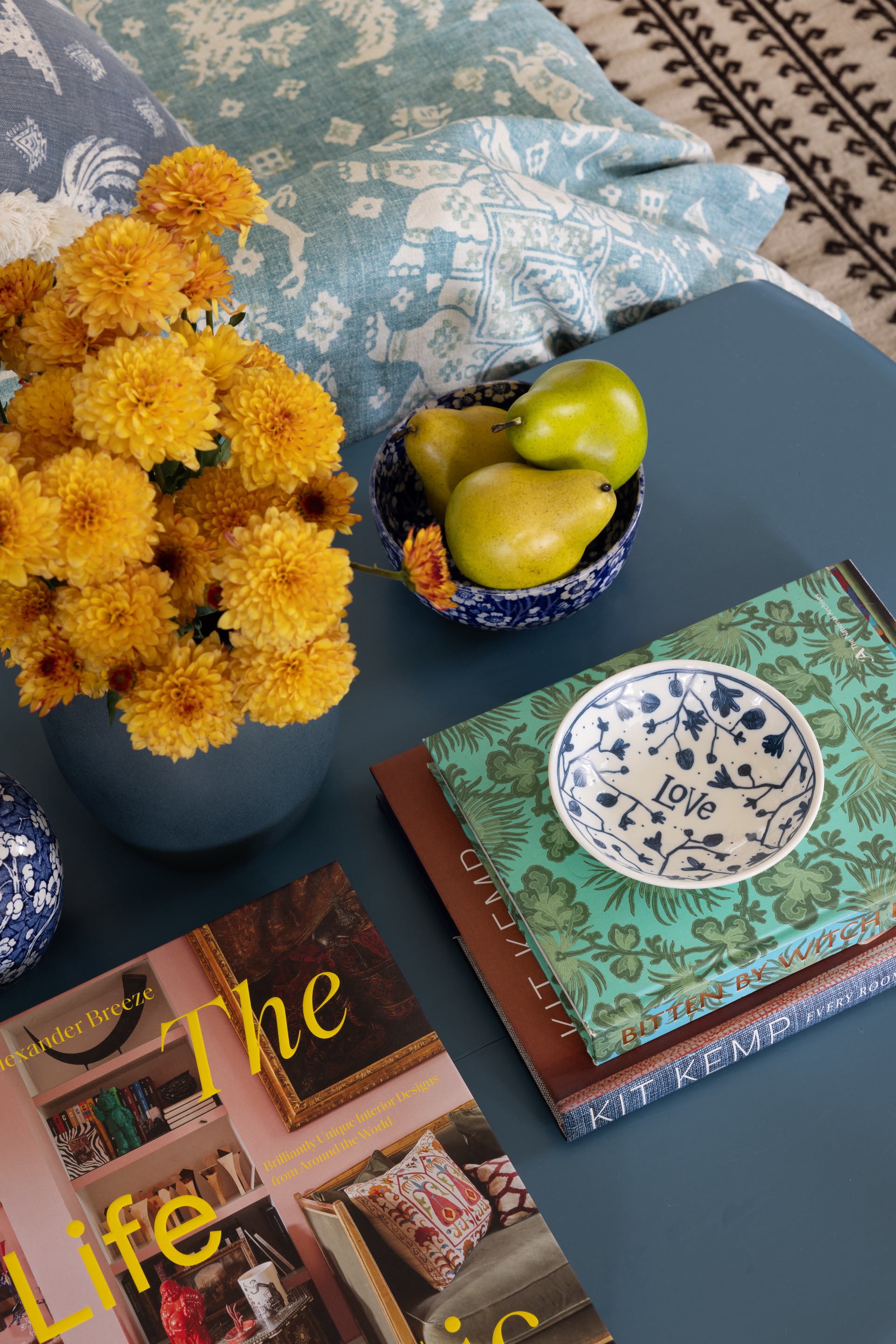 A collection of bright vintage-style décor and books.