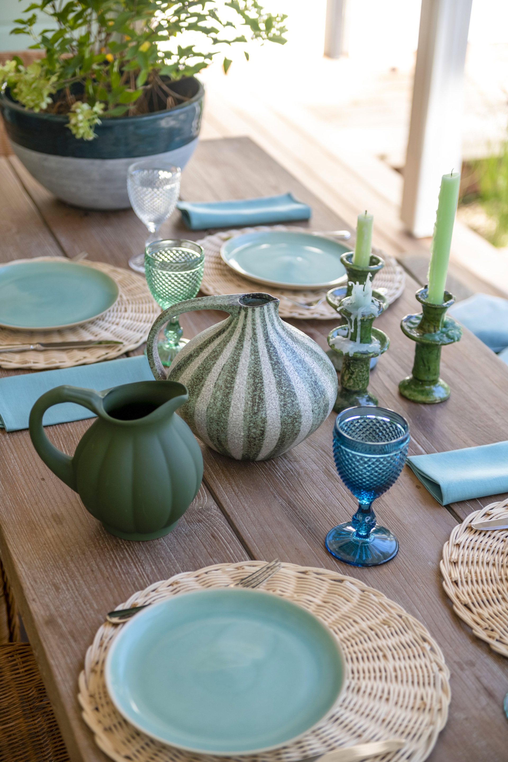 A tablescape with blue and green crockery.