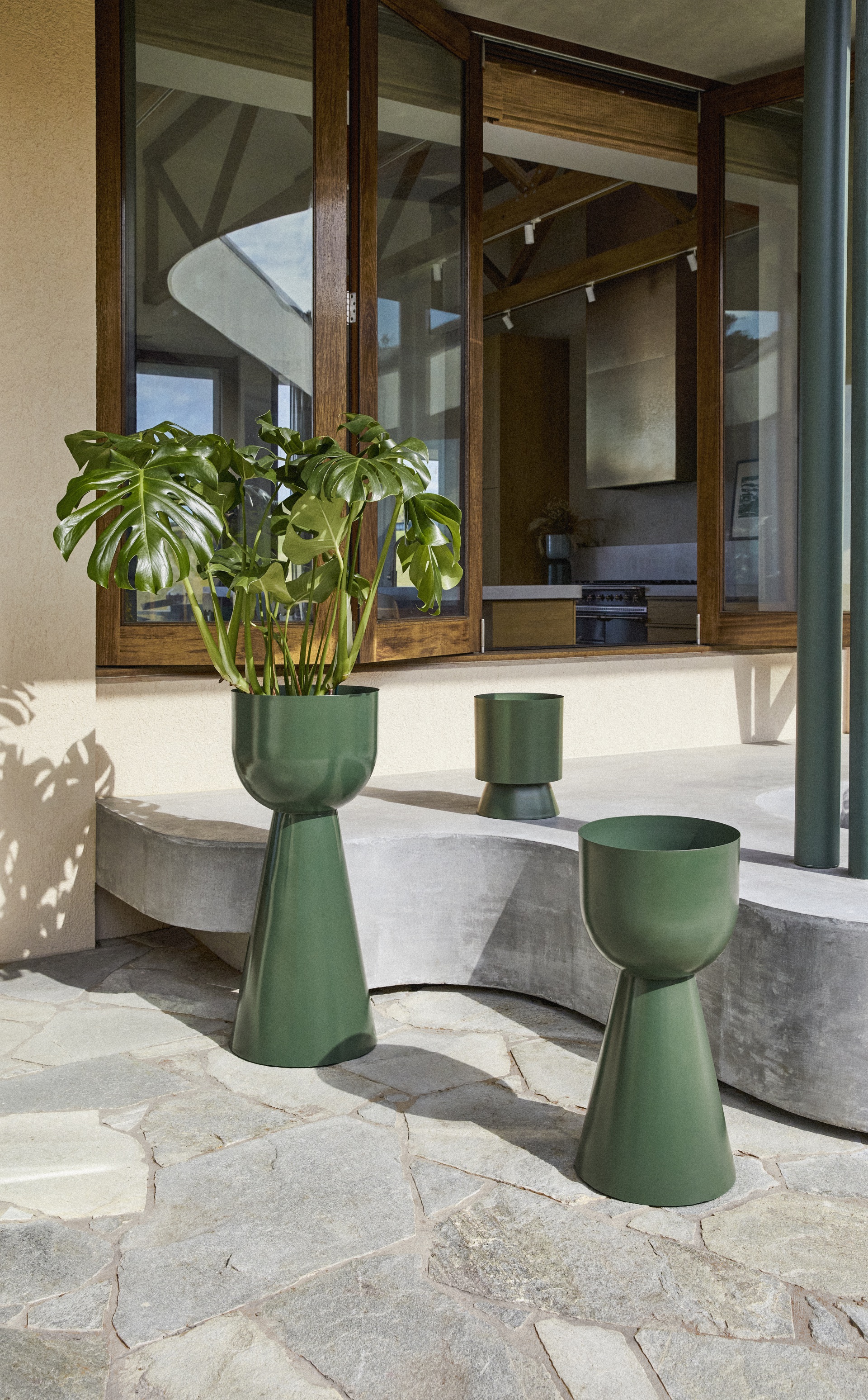 A collection of rounded green planters.