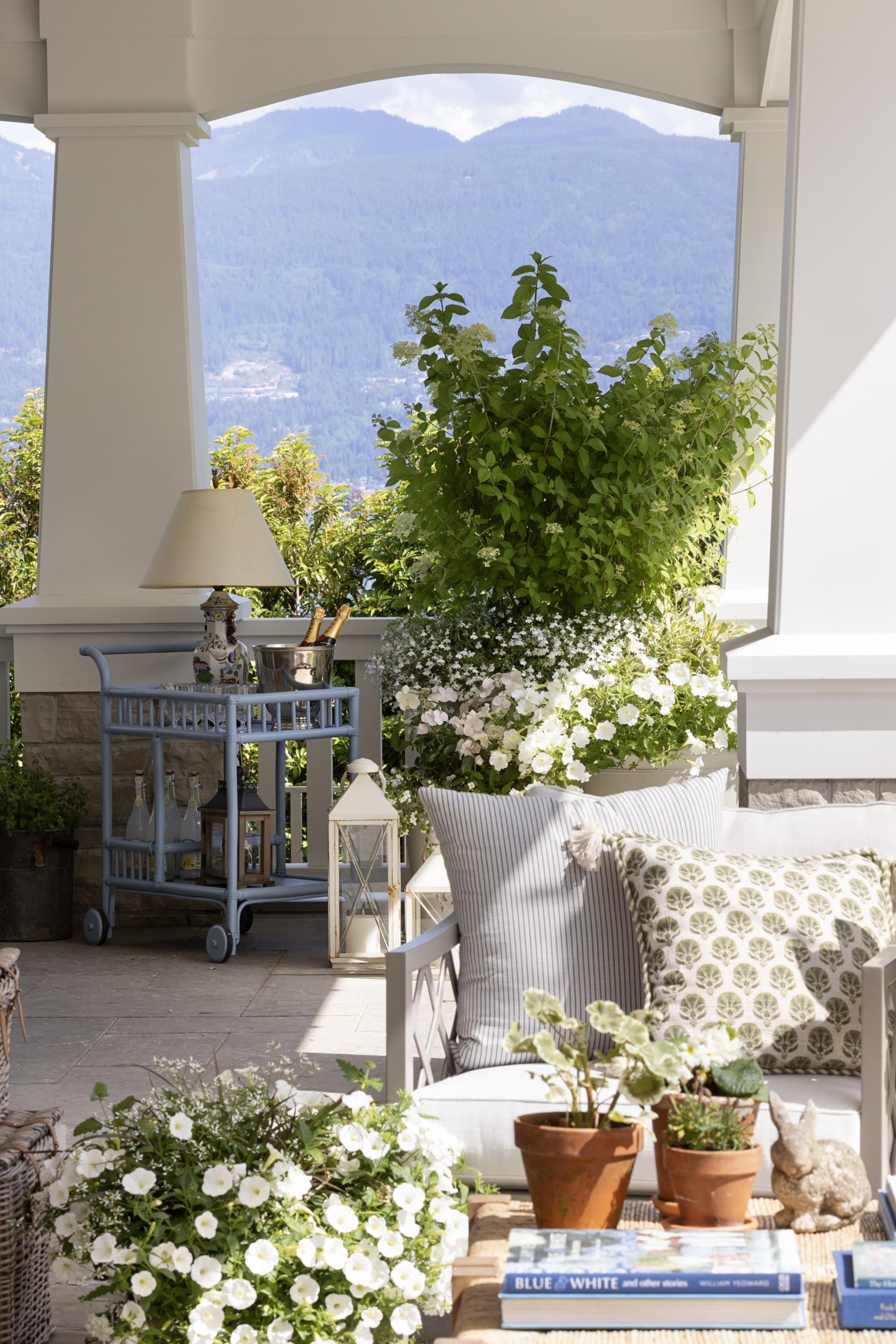 A blue bar cart in the outdoor alfresco area.