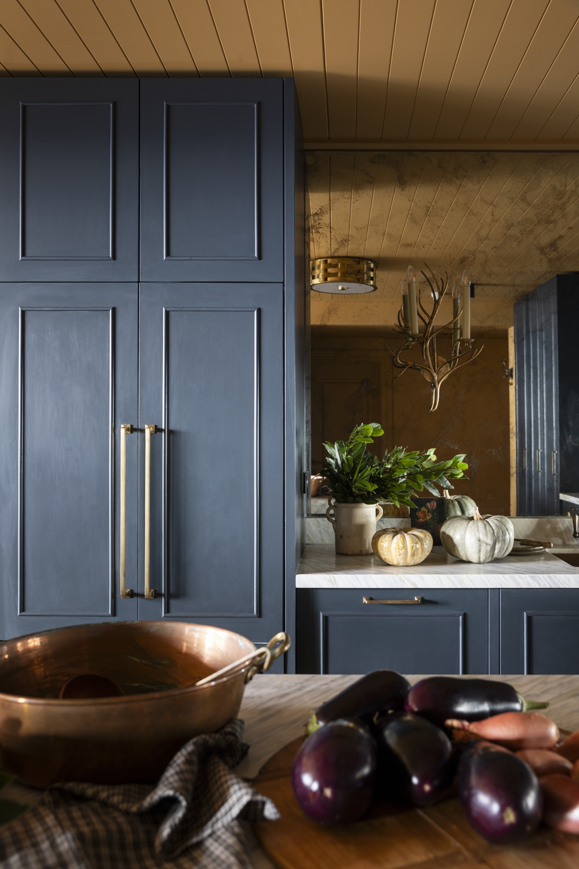 Dark blue shaker-style kitchen cabinets.