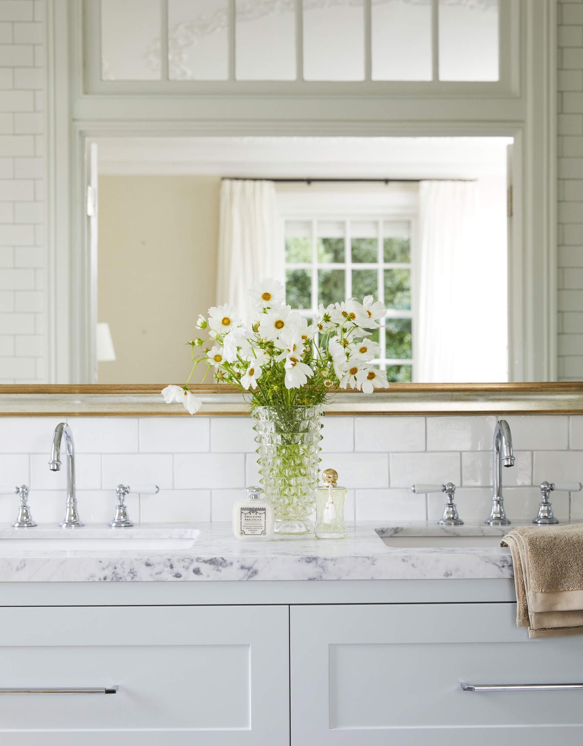 A classic white Carrara marble-topped double vanity.