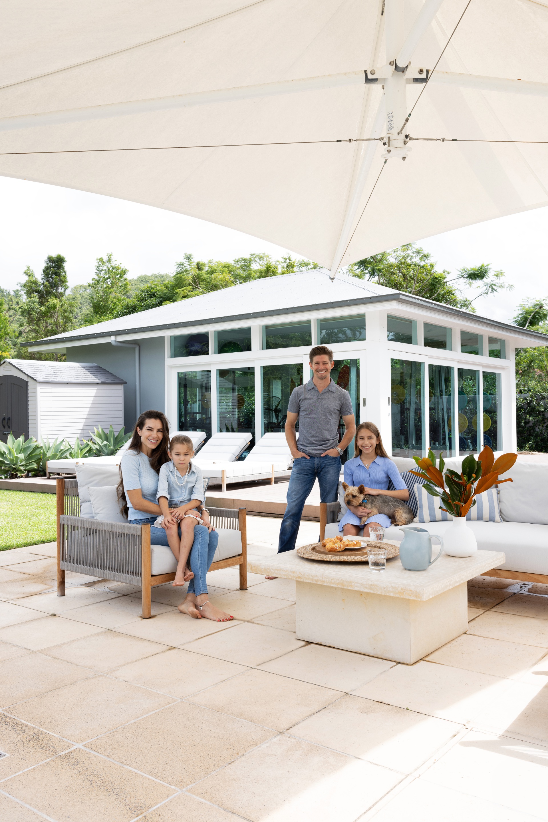 Adriana and Casey Stoner and their family in the outdoor seating area.