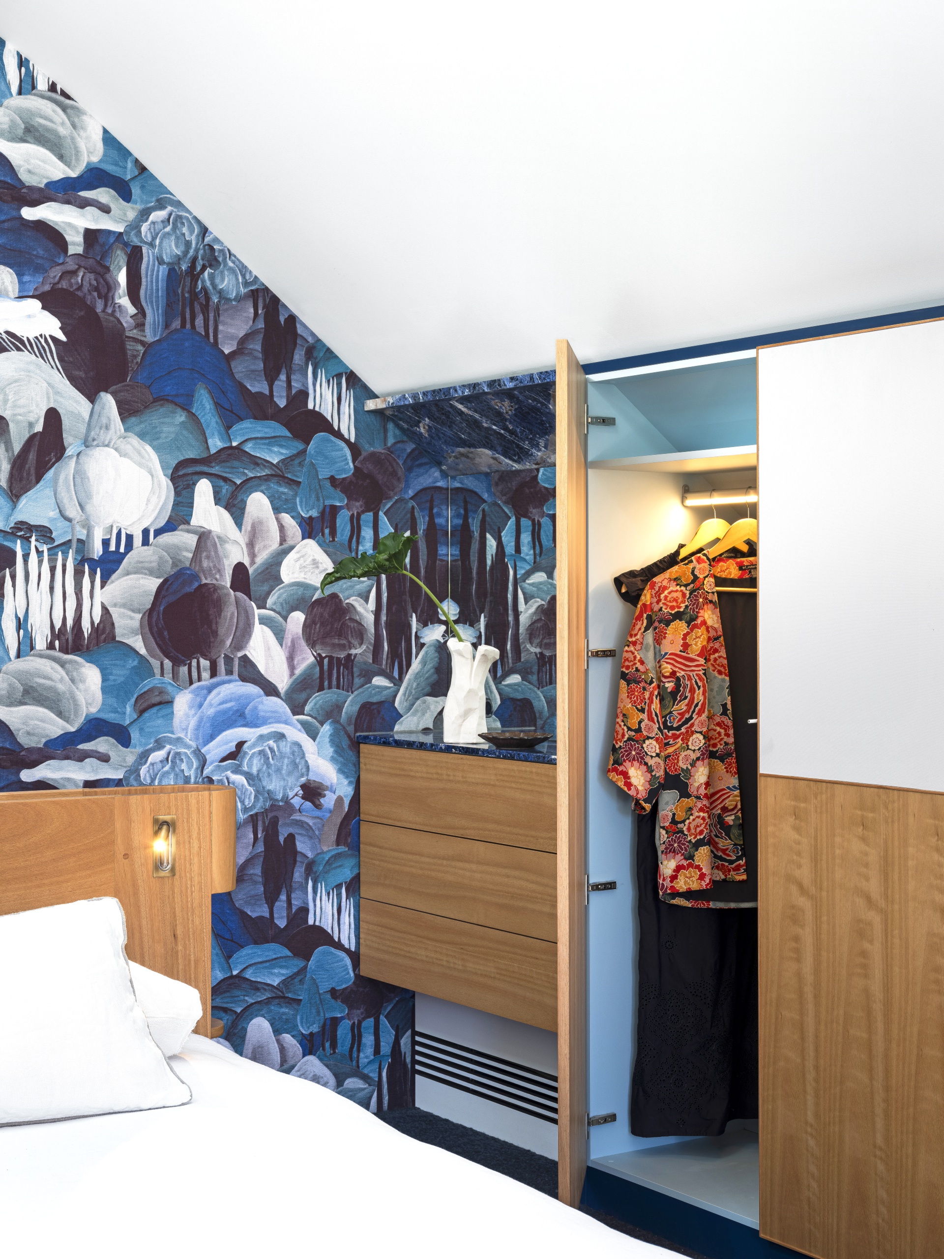 Blue patterned wallpaper in the bedroom. 