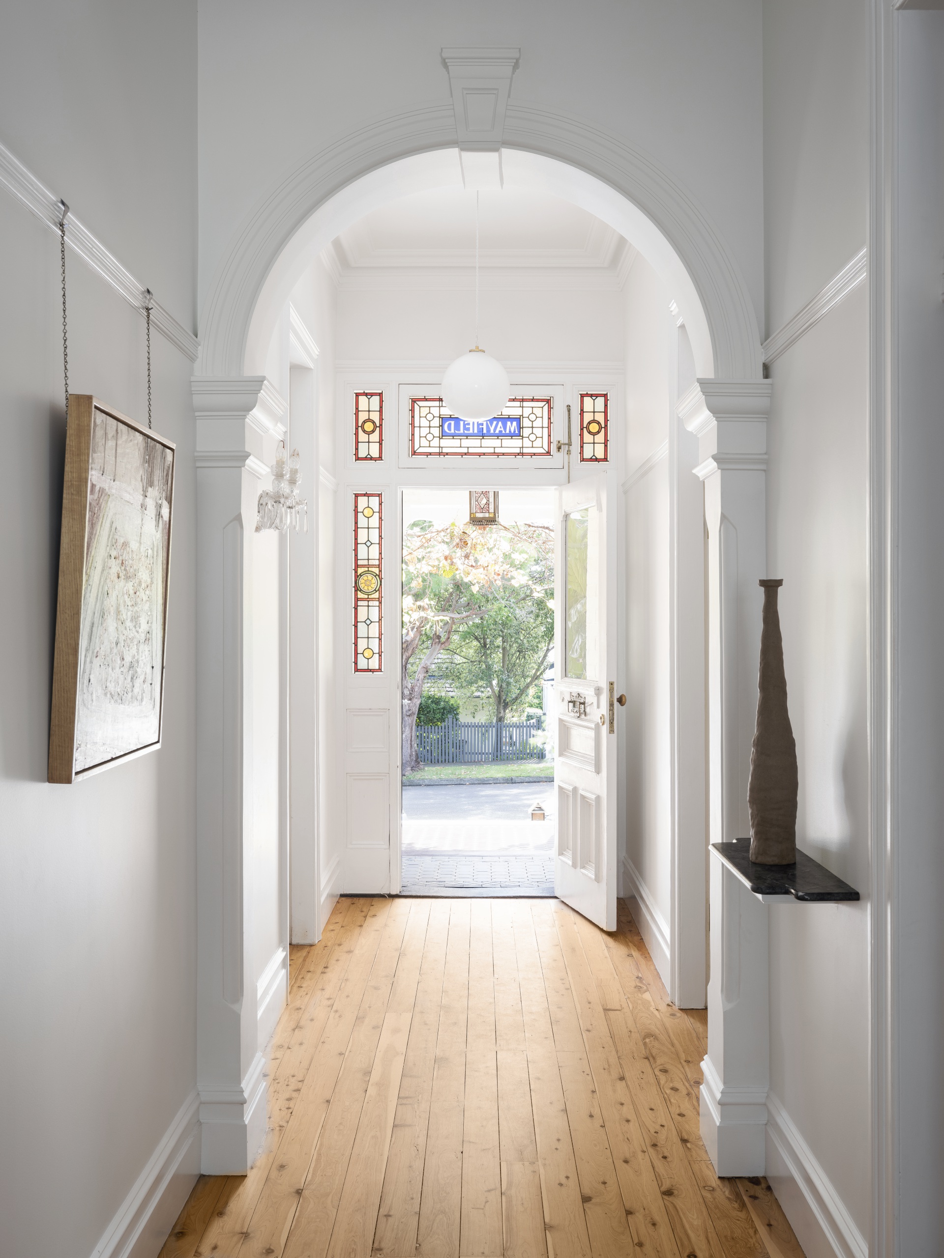 White hallway in renovated Queen Anne property. 