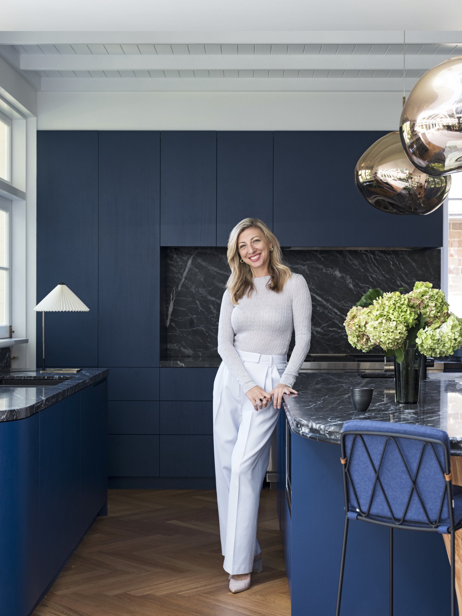 The homeowner in her blue kitchen. 