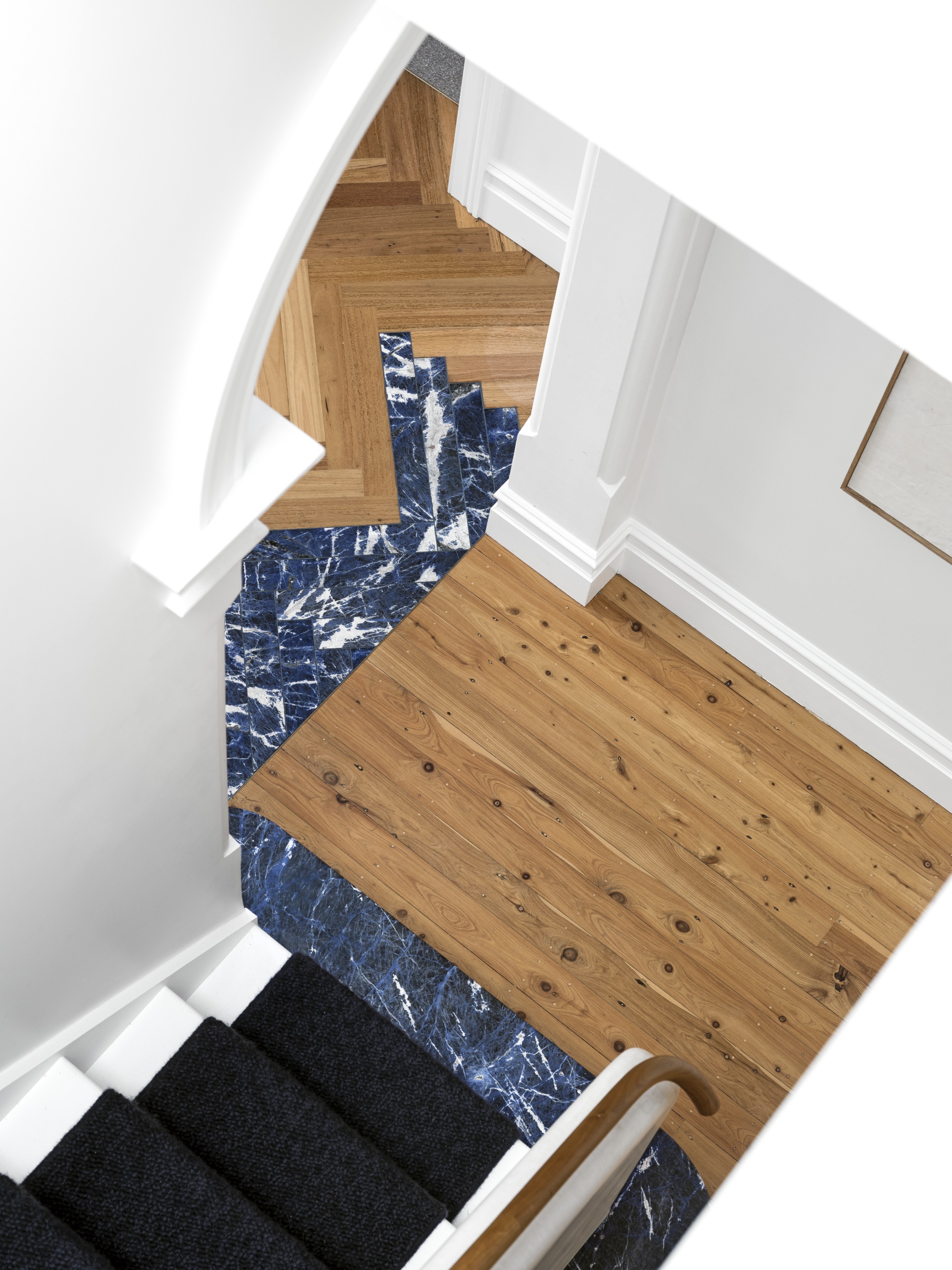 Blue tiles under the staircase. 