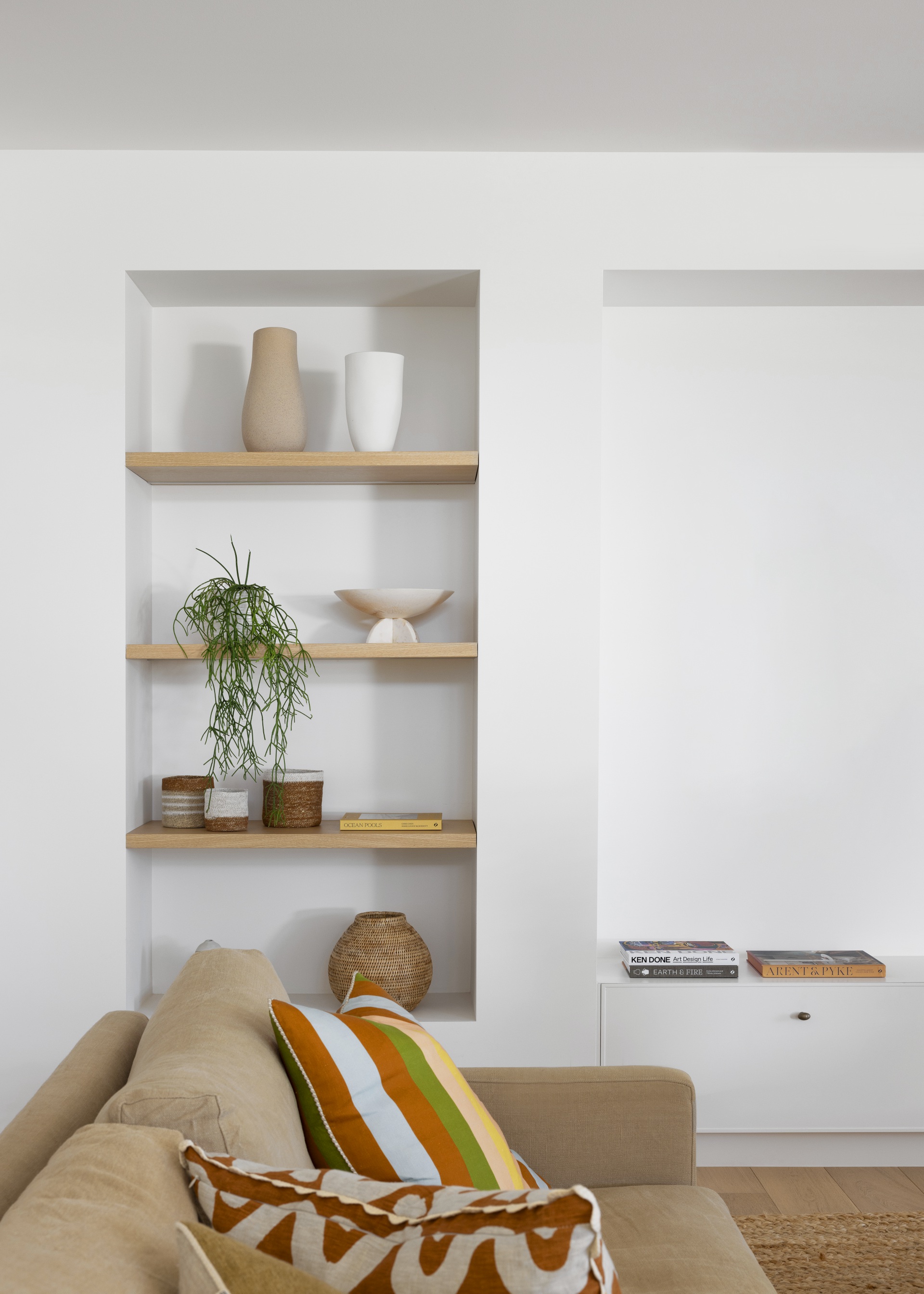 Nicola and Lachie Waller's open shelving in living room. 