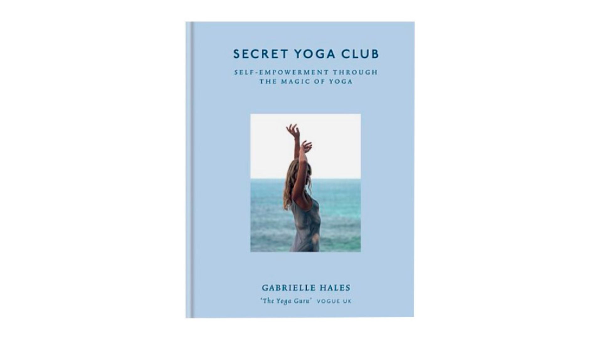 A blue hardcover book with a photo of a woman in front of the ocean on it