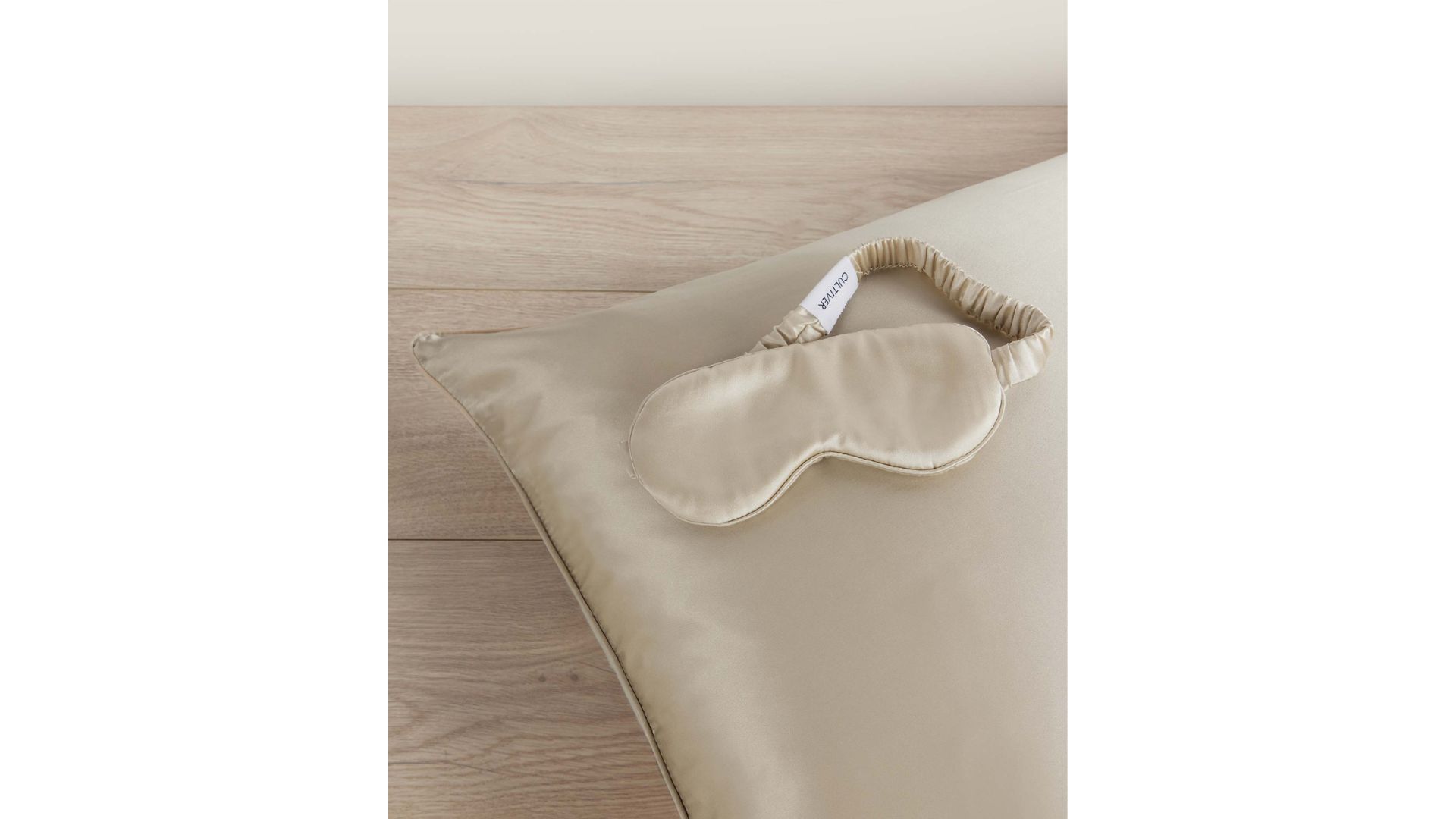 A silk eye mask and sil pillowcase in a neutral tone