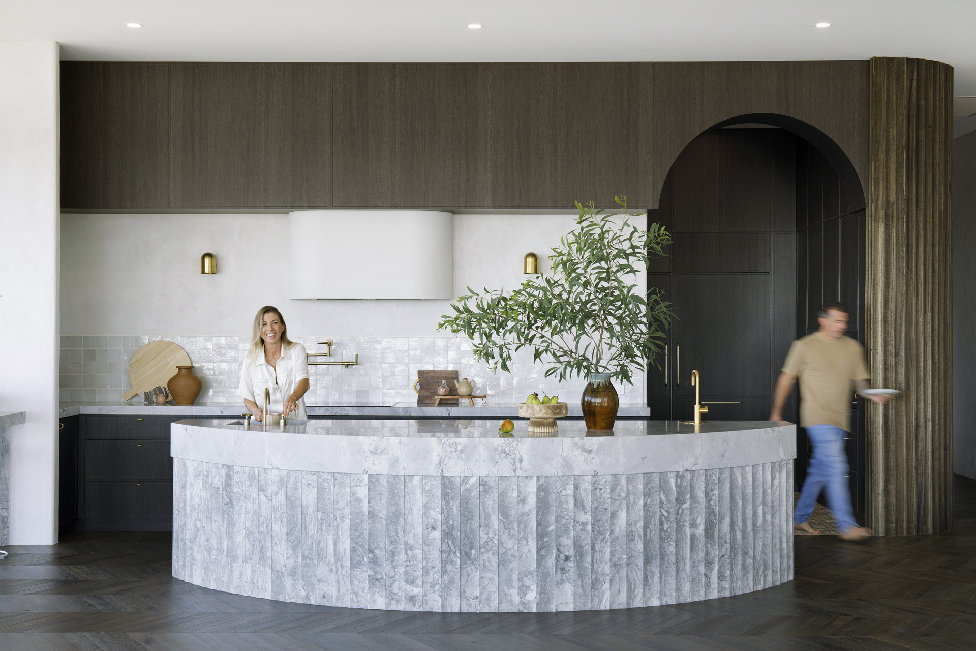 contemporary kitchen with curved marble kitchen island