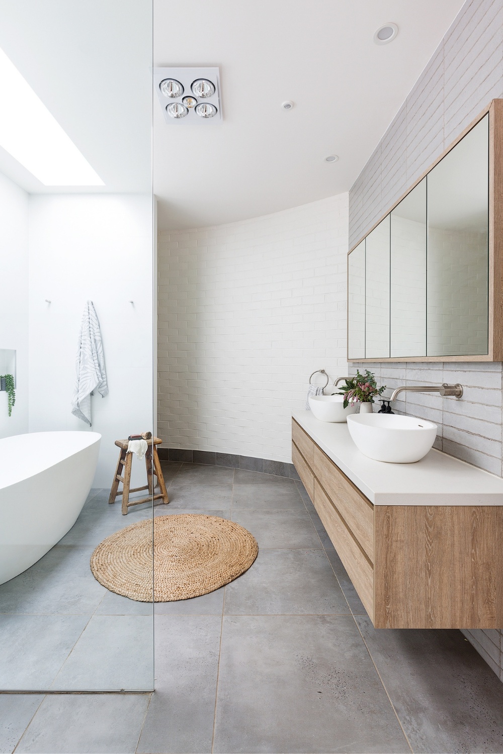 Coastal bathroom with grey concrete floor tiles