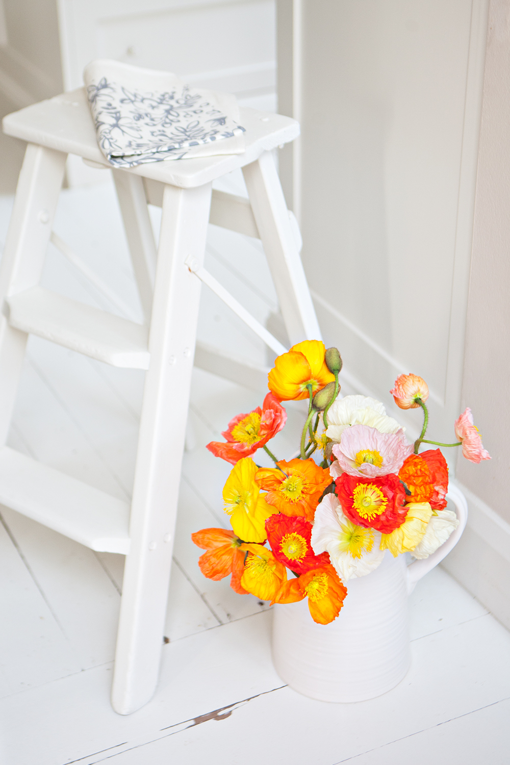 white-painted vintage step ladder