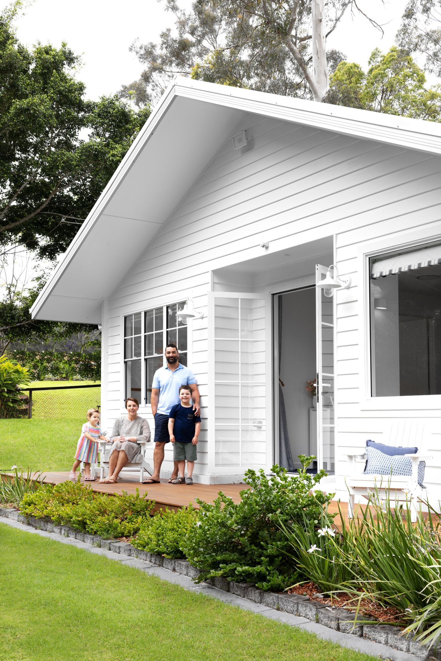 white home exterior family