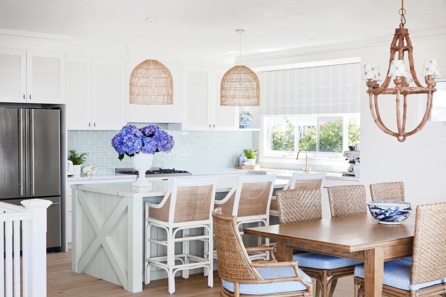 classic coastal white kitchen with rattan details