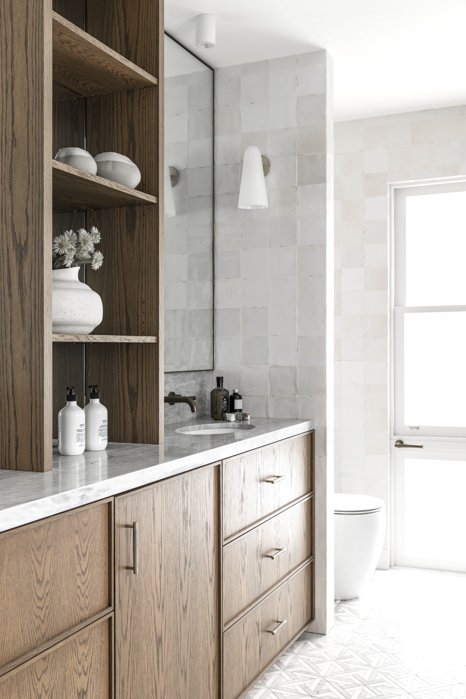 ensuite with square grey tiles