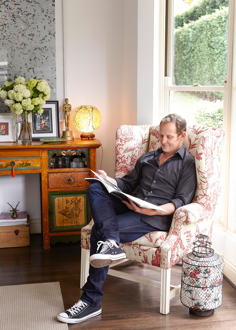 Todd McKenney sitting in his Sydney home